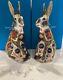 A Pair Of Royal Crown Derby Old Imari Solid Gold Band Hares -16.5cm Tall