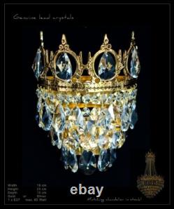 Royal Crown wall light with real crystals. Illustration antique gold